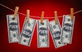 Dollars Hanging on Rope with Clothespins Royalty Free Stock Photo