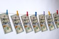 dollars hanging on a string. Concept of noney-laundering
