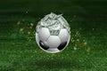Dollars are inside the soccer ball, the ball is full of money. Sports betting, soccer betting, gambling, bookmaker, big win Royalty Free Stock Photo