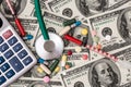 Dollars, pills, syringes stethoscope and calculato Royalty Free Stock Photo