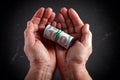 dollars rolled up in a tube in the hands of an elderly woman, close-up