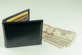 Dollars - Several banknotes of different denomination and black mens wallet. Cash Royalty Free Stock Photo