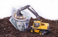 Dollars in the soil. a large expenditure of resources Royalty Free Stock Photo