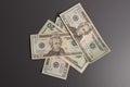 Dollars studio image. Money on deep grey background. Dollar bills.