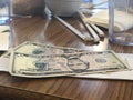 Dollars tip on the restaurant table Royalty Free Stock Photo