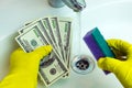 Dollars are washed in the sink Royalty Free Stock Photo