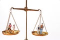 Dolls on Balancing Scales Royalty Free Stock Photo