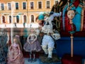 Dolls depicting fairytale heroes in a window of a Moscow Puppet Theater. Buildings opposite are reflected in glass