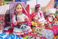 Dolls in ethnic costumes of peoples of Urals, traditional Irbit fair, Russia. Royalty Free Stock Photo