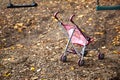 Dolls pram on empty playground