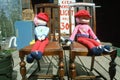 Dolls sitting on antique chairs, OR