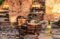 Dolls Thai dress on the floor bricks in a deserted temple.