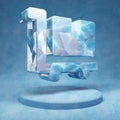 Dolly Flatbed icon. Cracked blue Ice Dolly Flatbed symbol on blue snow podium