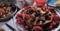 Dolly panning view of a breakfast of pancakes with berries and fruits