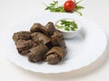 Dolma - minced meat in grape leaf with kiferno-garlic sauce Royalty Free Stock Photo