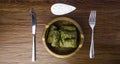 Dolma sarma or tolma stuffed grape leaves with rice, meat and white sauce cream Royalty Free Stock Photo