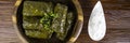 Dolma sarma or tolma stuffed grape leaves with rice, meat and white sauce cream Royalty Free Stock Photo