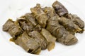 Dolma from vine leaves and mince on white plate