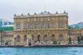 DolmabahÃ§e Palace on Bosphorus strait on rainy spring day Istanbul city Turkey Royalty Free Stock Photo