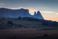 Dolomite mountain landscapes, Alpe di Siusi with Schlern Mountain Group in Background at sunset, Dolomite Alps, Italy