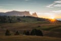 Dolomite mountain landscapes, Alpe di Siusi with Schlern Mountain Group in Background at sunset, Dolomite Alps, Italy