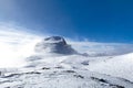 Cima Rosetta seen from tduring winter season with snowy landscape and foggy  blue sky Royalty Free Stock Photo