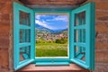 Dolomites. Idyllic alpine village of Gudon architecture and landscape view through window