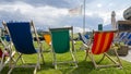 Dolomites, Italy. Group of colored deckchairs outside the mountain lodge in summer time Royalty Free Stock Photo