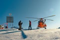 Medical rescue helicopter waiting to transport a skier, on the Dolomiti Superski domain in Italy Royalty Free Stock Photo