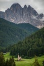 Dolomites, Italy - July, 2019: Famous best alpine place of the world, Santa Maddalena village with Dolomites mountains in