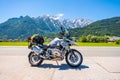 Dolomites Italy - July 2, 2022: Motorcycle with full equipment on the side of a rural mountain alpine road in area of