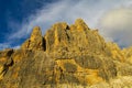 Dolomites rocky mountain wall at sunset yellow light Royalty Free Stock Photo