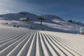 Dolomites, ski area with beautiful slopes. Empty ski slope in winter on a sunny day. Prepare ski slope, Alpe di Lusia, Italy