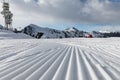 Dolomites, ski area with beautiful slopes. Empty ski slope in winter on a sunny day. Prepared piste and sunny day