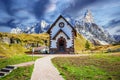 Dolomites, Sudtirol - Italy. Cimon della Pala mountain and the church of Passo Rolle