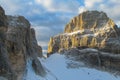 Rocky cliffs tower of Dolomites mountains above the pass, Dolomiti di Brenta Royalty Free Stock Photo