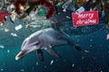 dolphin with a merry christmas sign in a sea ocean full of plastic garbage debris Generative AI