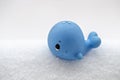 Dolphin rubber toy on snow Royalty Free Stock Photo