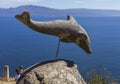 A dolphin sculpture at the Cape Finisterre Lighthouse, in the coast of Galicia, Spain.