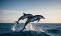 Dolphins Arcing Over Ocean Waves Royalty Free Stock Photo