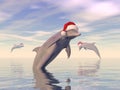 Dolphins celebrating christmas in the ocean - 3D render Royalty Free Stock Photo
