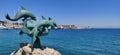 Dolphins ocean coast statue greece Rhodes harbour