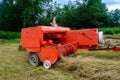 Dolyna, Ukraine July 11, 2020: baling hay, summer time, forage harvesting for cattle