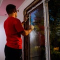 Dolyna, Ukraine July 31, 2020: an employee installs a window in the house, installation of a plastic window, wds windows, energy- Royalty Free Stock Photo