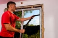 Dolyna, Ukraine July 31, 2020: an employee installs a window in the house, installation of a plastic window, wds windows, energy- Royalty Free Stock Photo