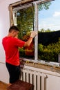 Dolyna, Ukraine July 31, 2020: an employee installs a window in the house, installation of a plastic window, wds windows, energy- Royalty Free Stock Photo