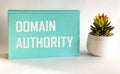 Domain Authority, the text is written on a green notepad