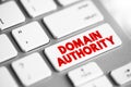 Domain authority - website describes its relevance for a specific subject area or industry, text concept button on keyboard Royalty Free Stock Photo