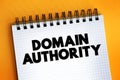 Domain authority - website describes its relevance for a specific subject area or industry, text concept on notepad