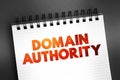 Domain authority - website describes its relevance for a specific subject area or industry, text concept on notepad